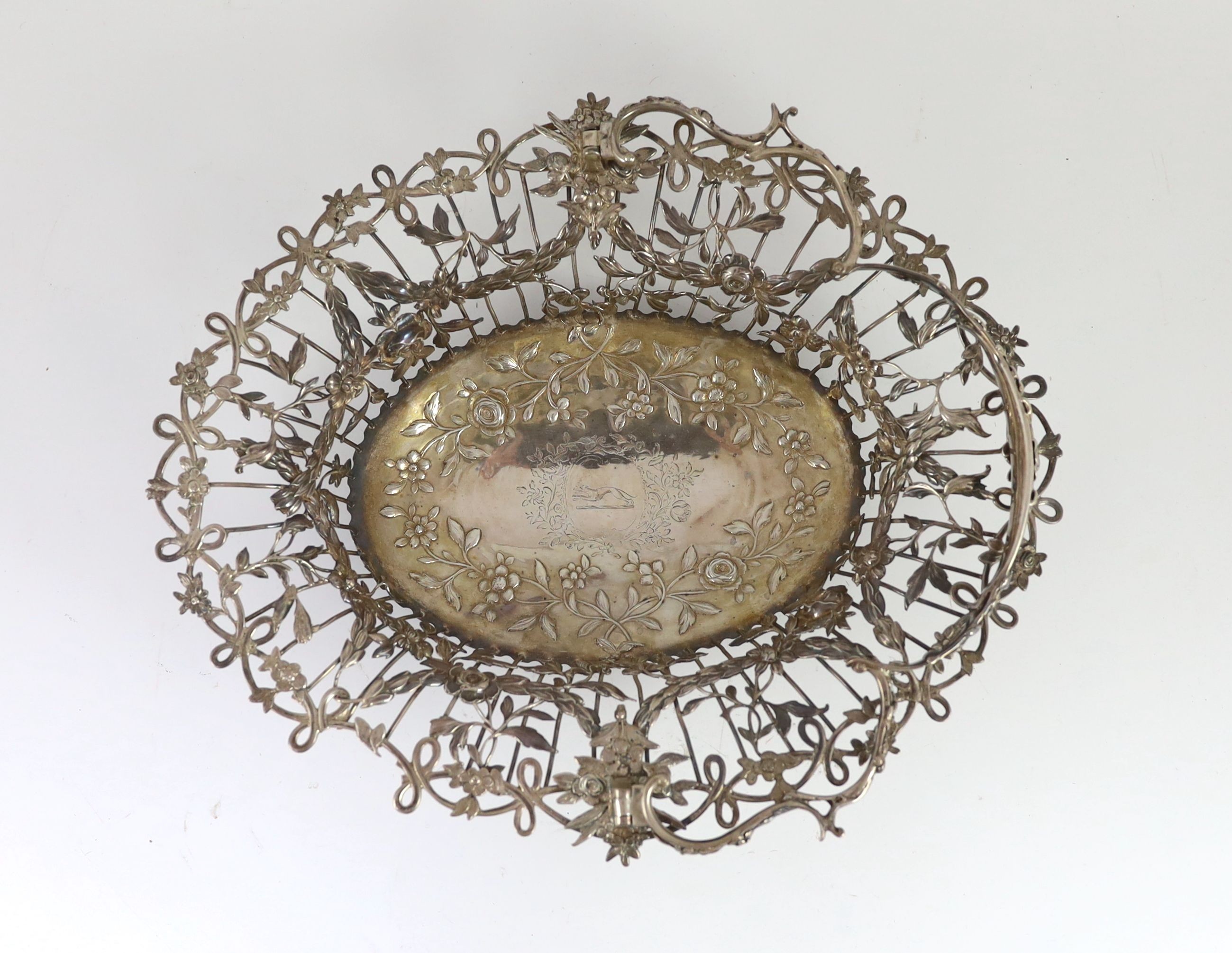 A George III pierced silver oval epergne basket, by Vere & Lutwyche, engraved with the Heneage family crest